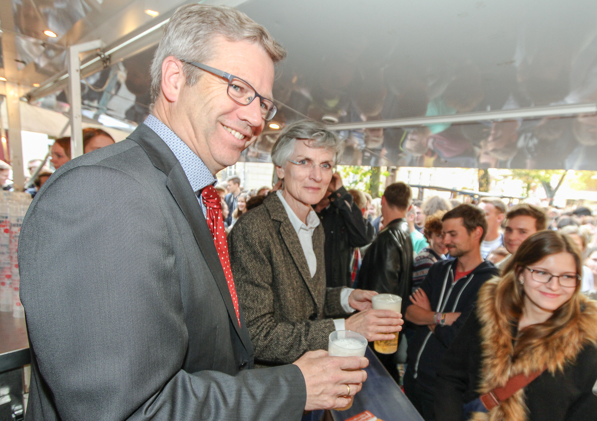Greifswald's Mayor and the Rector of the University of Greifswald tapping beer